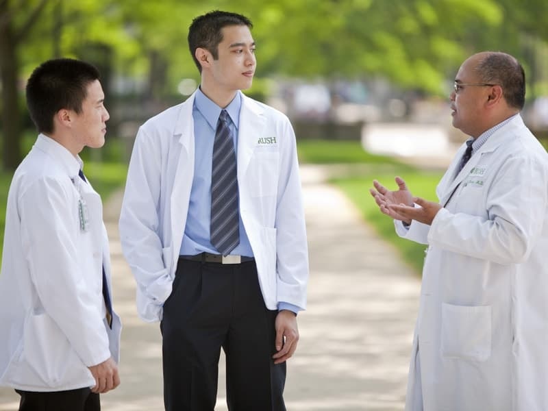 Rush University Medical Center doctors talking while outside.