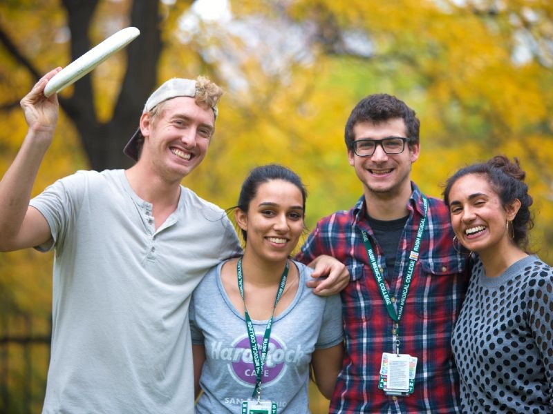 Students playing Frisbee outdoors.