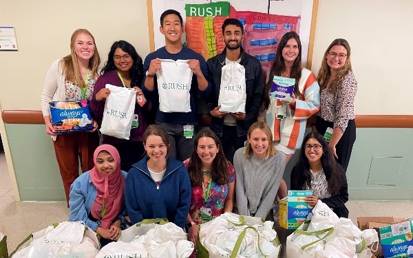 A group of residents with totle pags and packages of supplies
