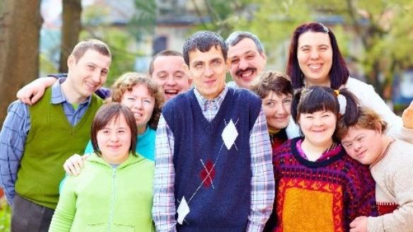 A nurse with a group of people with intellectual disabillities.